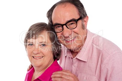 Closeup portrait of smiling aged couple