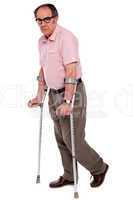 Depressed senior male with two crutches