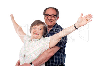 Mature woman with arms outstretched