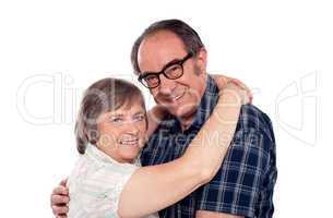 Senior couple in love hugging each other