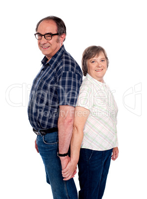 Affectionate couple posing back to back