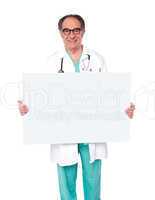 Male doctor posing with white blank billboard