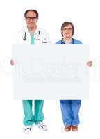 Medical professionals showing blank billboard