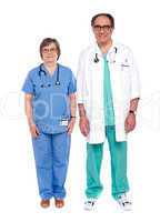 Two senior male and female physicians