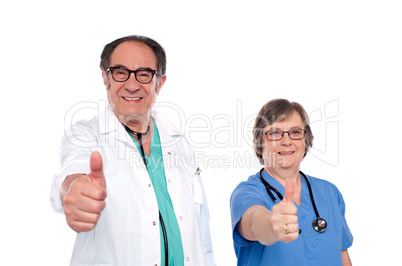 Medical professionals showing thumbs up