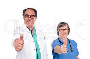 Medical professionals showing thumbs up