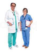 Senior male doctor posing with female nurse