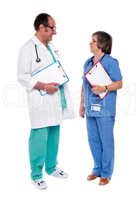 Male and female doctors discussing a case
