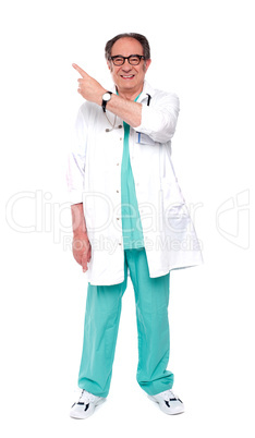 Full length image of doctor indicating up