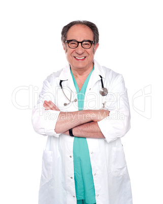 Senior doctor posing with arms crossed