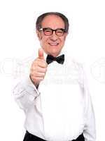 Smiling old man gesturing thumbs up