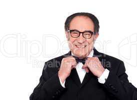 Cheerful old man in classical tuxedo