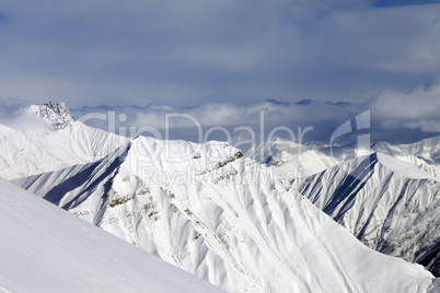 Ski slope and snowy mountains