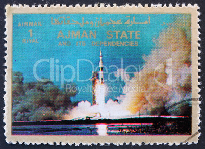 Postage stamp Ajman 1973 Saturn V Rocket Launching