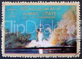 Postage stamp Ajman 1973 Saturn V Rocket Launching