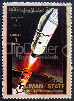 Postage stamp Ajman 1973 Rocket in Space