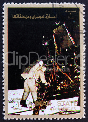 Postage stamp Ajman 1973 Aldrin Stepping out of the Eagle