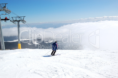 Skier rides on a slope in Strbske Pleso ski resort, High Tatras,