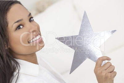 African American Woman Holding SIlver Star