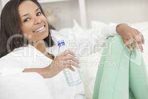 African American Woman Drinking Bottle of Water