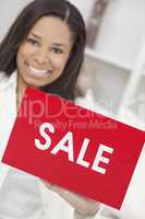 African American Woman Holding Sale Sign