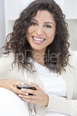 Happy Hispanic Latina Woman Drinking Red Wine