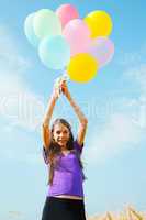 teen girl at a wheat field with balloons