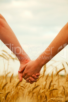 young couple holding hands