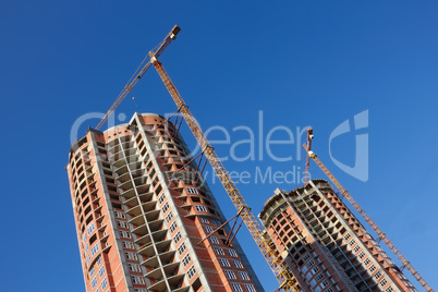 Construction of two parallel skyscrapers