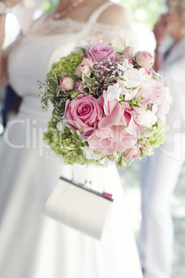 Pretty pink roses in bridal bouquet