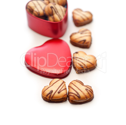 heart shaped cream cookies on red heart metal box