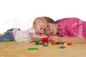 Mum and baby playing with building blocks