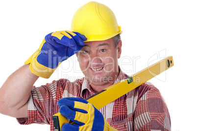 Friendly construction worker with a spirit level and safety gloves