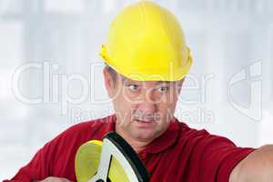Construction worker with tape measure