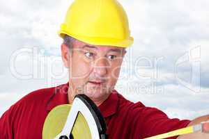 Construction worker with tape measure