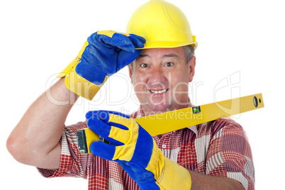 Friendly construction worker with a spirit level and safety gloves