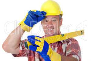 Friendly construction worker with a spirit level and safety gloves