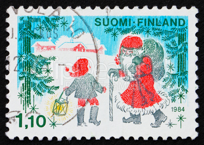 Postage stamp Finland 1984 Father Christmas and a Child