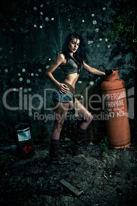 Macho woman posing with gas bottle