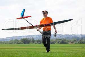 Man holds the RC glider