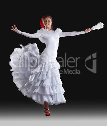 Young woman show white flamenco costume