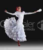 Young woman show white flamenco costume
