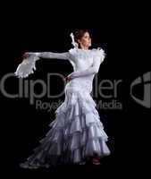 Young woman dance in white flamenco costume