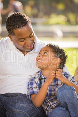 Happy Mixed Race Father and Son Playing