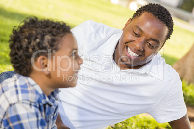 Happy Mixed Race Father and Son Playing