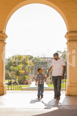 Mixed Race Father and Son Walking in the Park