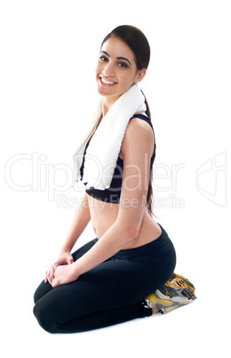 Young woman doing yoga exercise