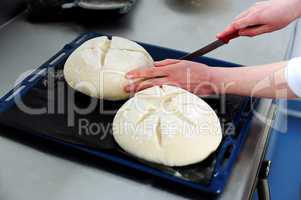 Female cutting dough in a creative manner