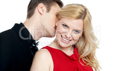 Closeup of young man kissing his lovers neck