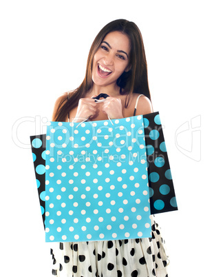 Excited young shopaholic woman posing